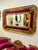 Magnificent Rococo style wall mirror featuring an oversized rectangular silhouette adorned with luxurious gold leaf...