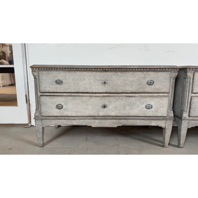 This striking pair of Danish chests, dating from the early 19th century, showcases the understated elegance of Nordic...