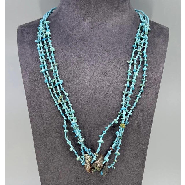Late 20th century turquoise heishi and small nugget multi strand necklace. Four large polished turquoise nuggets mostly...