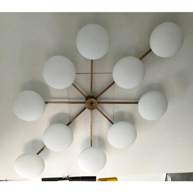 Italian midcentury flush mount with ten matte white Murano glass shades mounted on solid brass frame in bronze finish /...
