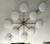 Italian midcentury flush mount with ten matte white Murano glass shades mounted on solid brass frame in bronze finish /...