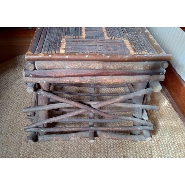 Mid century bent willow Adirondack style table. Very sturdy and quite heavy.. Top 20" x 32" base 26" x 36" 22" high....