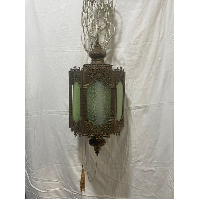 This Vintage 6 sided, Brass Swag Lamp is a charming piece with a Hollywood Regency style, perfect for all occasions. With...