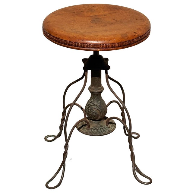 American adjustable piano/organ stool by the Charles Parker Company of Meriden, Connecticut. The stool features a solid...