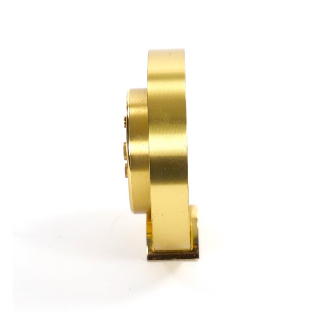 An elegant mid-20th-century desk clock by Tiffany & Co., dating to circa 1960, featuring a refined combination of gilt...