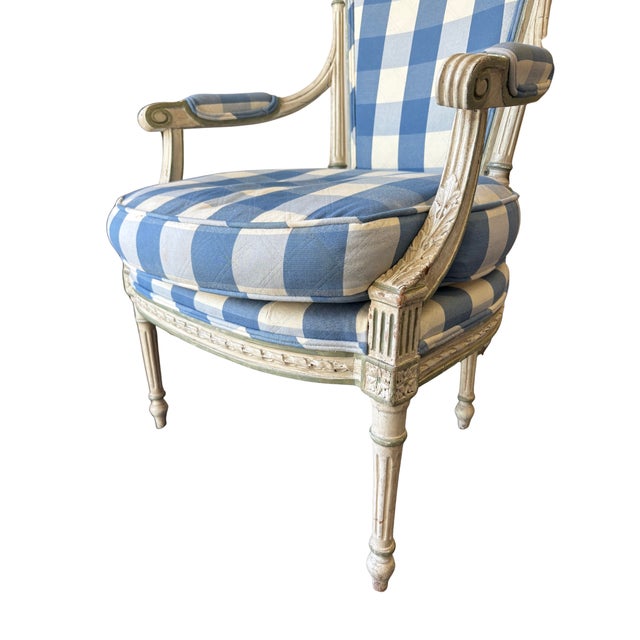 Bring effortless French charm into your home with this beautifully carved armchair, featuring an antique painted frame and...