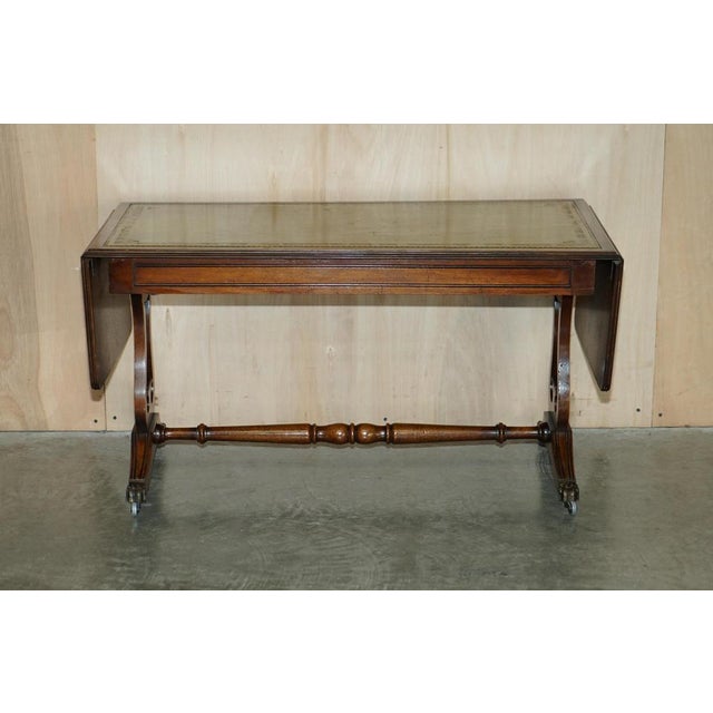 Lovely condition Bevan Funnell Mahogany green leather large extending coffee table. This is a very well made and versatile...