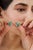 These 3.55 carat emerald and diamond floral cluster stud earrings are crafted in 925 sterling silver and feature oval cut...