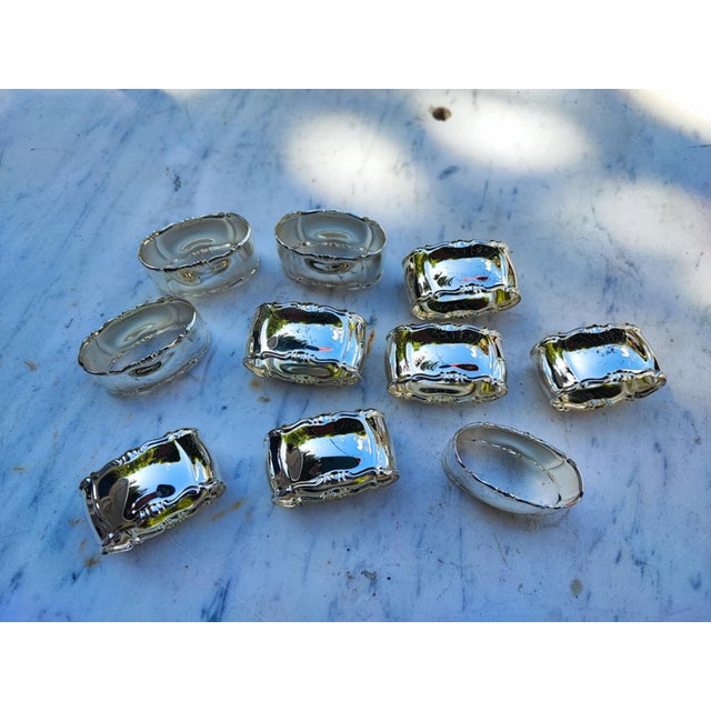 Art Nouveau, set of plated napkin holders, 10 pieces, dimensions: height 2.6 cm, width 4.8 cm, depth 2.8 cm.