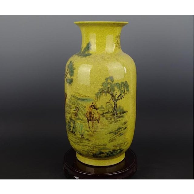 H-cm,W-cm. This Chinese Ceramic Vase showcases exquisite craftsmanship from the Qing Dynasty with a Qianlong mark. The...