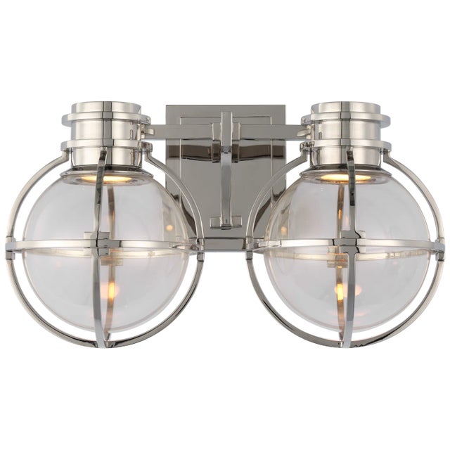 Gracie Double Sconce in Polished Nickel with Clear Glass Designer: Chapman & Myers Height: 8.75" Extension: 8.25"...