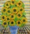 A decorative contemporary floral still life by listed artist Royston du Maurier-Lebek, depicting a vibrant arrangement of...