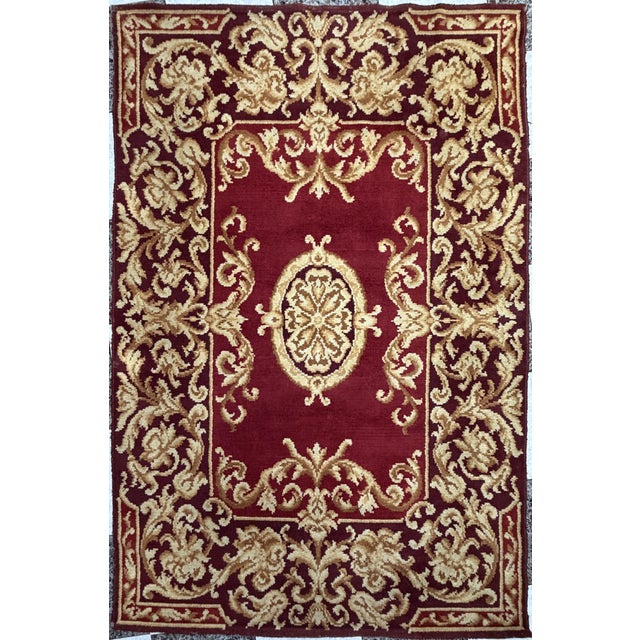 Spanish hand-knotted wool rug, possibly from the Royal Tapestry Factory, first half of the 20th century. Crimson red...
