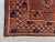 Ruby Red Antique Afghan Baluchi Rug With Geometric Tribal Medallion Design in Terracotta and Navy Rug For Sale - Image 8 of 11