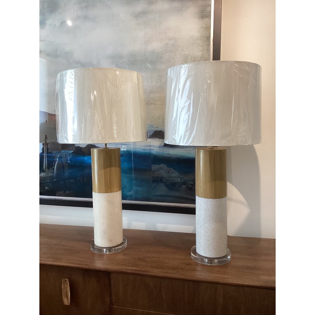 Heavy stone lamps with faux wood finish, lucite bases and new drum shades.