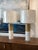 Heavy stone lamps with faux wood finish, lucite bases and new drum shades.