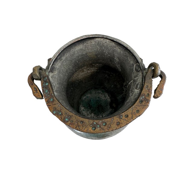 A wonderfully sculptural antique South Indian water vessel, hand-hammered in copper and distinguished by an exceptionally...