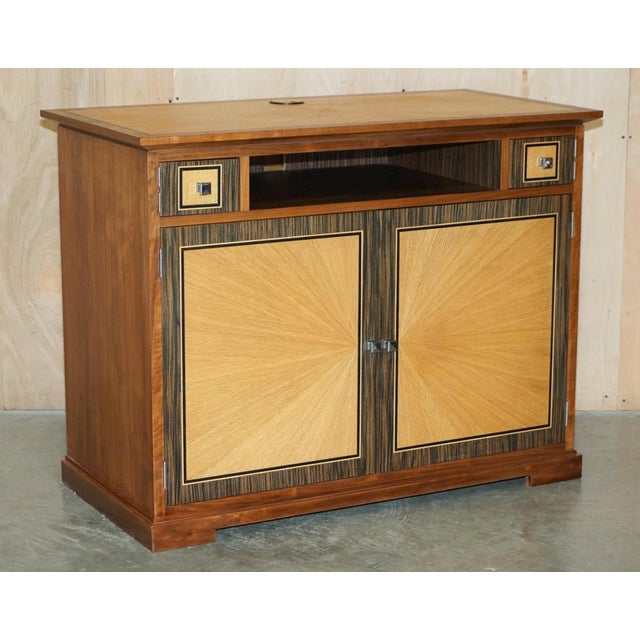 This absolutely exquisite pair of viscount david linley satinwood & macassar ebony sideboards designed to seat a...