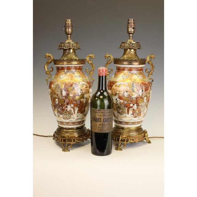 Pair of large japanese satsuma table lamps in gilt bronze ormolu mounts, meiji period c.1880 a superb and highly...