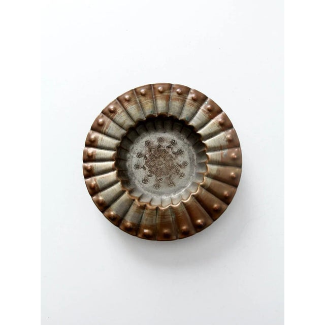 This is a 1960s vintage copper bowl from the United Arab Republic, showcasing hand-crafted metalwork and distinctive mid-...