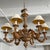 This late 20th century Italian Baroque style chandelier features a 30" diameter carved wood body with six arms. The...