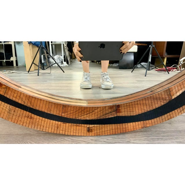 Stylish Currey & Co. Abstract Modern Black Resin and Wood Round Wall Mirror, showroom floor sample