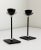 A pair of 1980s postmodern Memphis style candle holders. Featuring black metal, diamond-shaped base, and winged chrome...