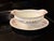 An exquisite antique porcelain gravy boat with an attached presentation underplate, produced by Royal Schwarzburg in...