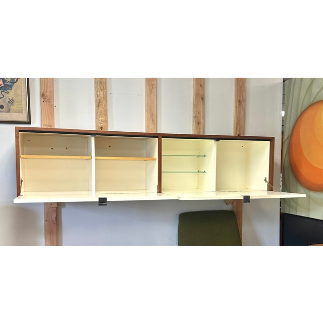 The Florence Knoll Wall Hung Credenza is a stunning piece that brings elegance and functional sophistication to any...