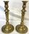 Elegant pair of antique French candlesticks from the early 20th century. They are made of heavy brass with an embossed...
