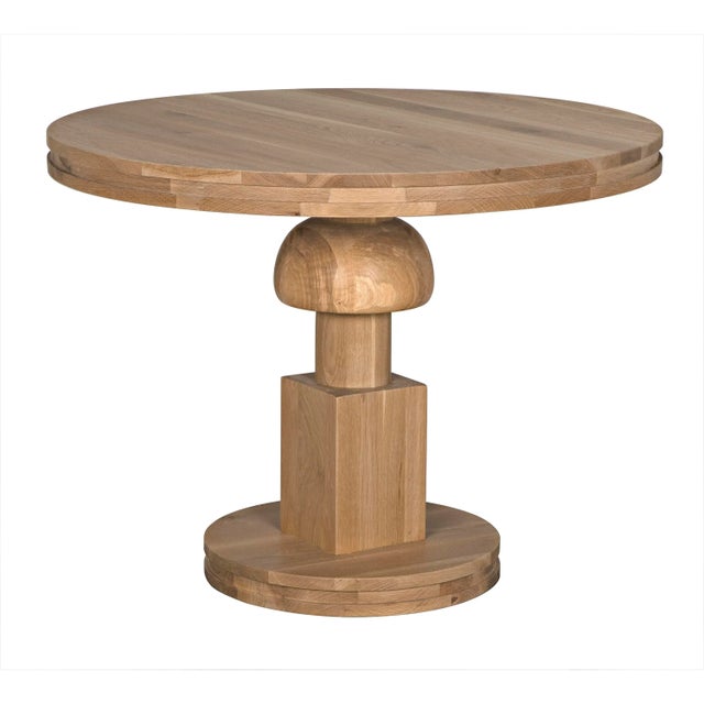 The Baron Table in White Oak by Noir Trading, Inc. is a true testament to elegance and craftsmanship, perfect for...