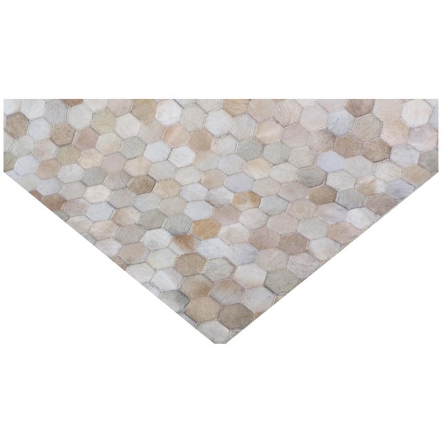 Carefully selected hair-on hide sections in various shades and colors are hand-stitched together to create a stunning and...