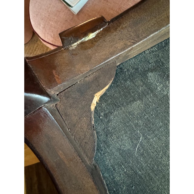 This chair has been in my family for as long as I can remember and was inherited from my mother. I believe it may...