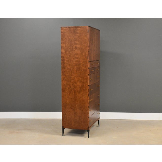 A rare mid century modern walnut color birch tall dresser armoire with small iron legs made by Heywood Wakefield Contessa....