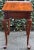 Elegant solid cherry tea table by Pennsylvania House. Features elegant cabriole legs with pad feet, pullout slides and a...