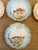 A charming antique set of Limoges France porcelain plates featuring delicately scalloped edges with soft pastel washes of...