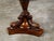 An English walnut side table from the 19th century, with hexagonal top, grape vine carved apron and dolphin motifs....