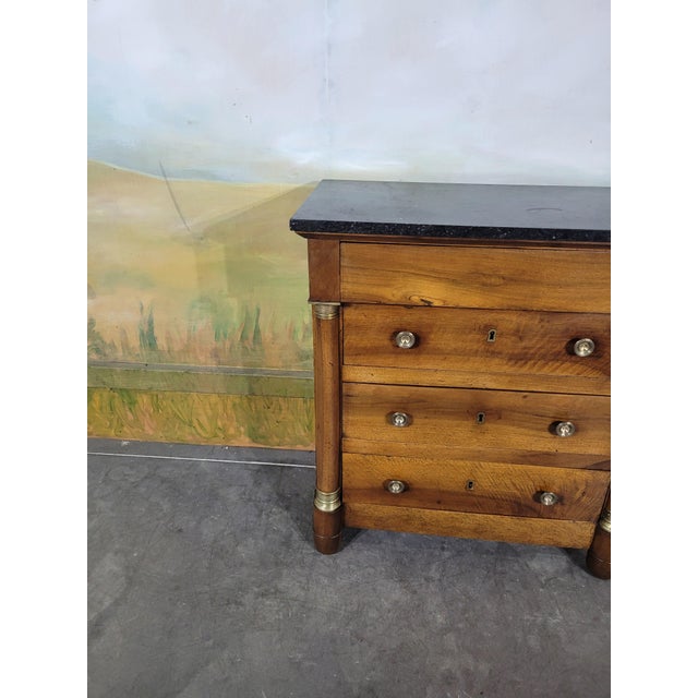 Small Empire period chest of drawers in solid walnut. This model, with its half-columns, has unusual proportions. The top...