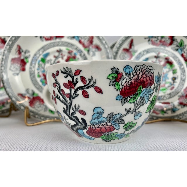 Set of 8 6 oz. cups and saucers in the Indian Tree pattern. The maker is Wood's Burslem, England. The bottom of the ware...