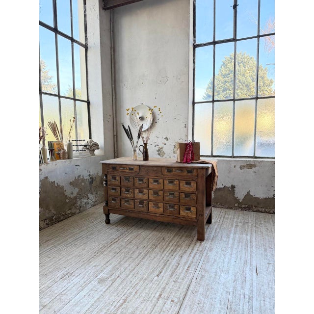 Antique workshop/craftsman's counter, crafted from solid oak with drawers and some pine elements, dating from the 1950s....