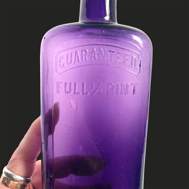 Victorian Early 20th C. Amethyst Embossed Half-Pint Whiskey Bottle For Sale - Image 3 of 12