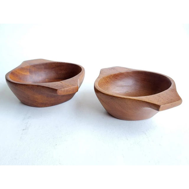Offered is a set of 2 hand carved Taverneau wood snack or trinket bowls in the style of Arthur Umanoff. Both have their...