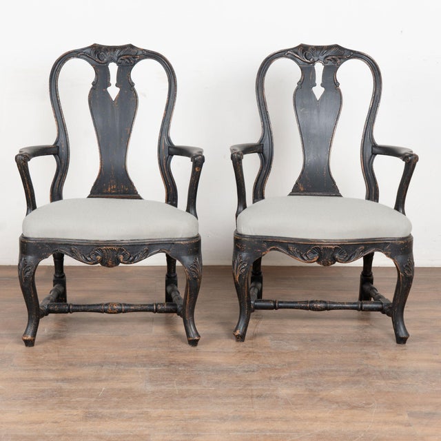 Pair of 19th century Swedish Rococo armchairs, crafted in pine. Great Rococo curves accentuate the arms, cabriolet legs,...