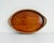 French style, early 20th-century woven wicker oval tray in a mid-brown color. Features braided wicker rim, integrated...