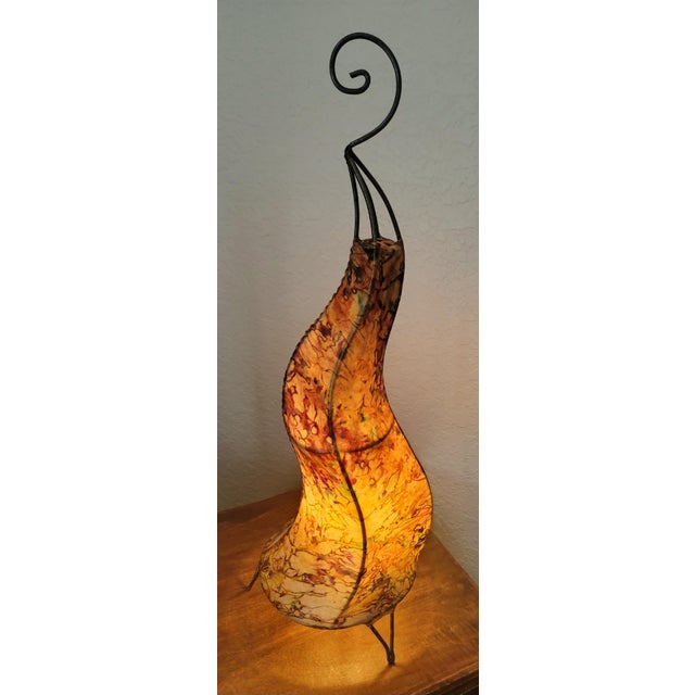 A radiant piece of Moroccan artistry, this handmade henna lamp brings the warmth of the Maghreb into any space. Crafted by...