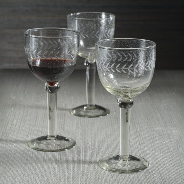 Raise a toast with the Tuscan Handmade Etched Wine Goblet, a beautifully handcrafted piece made from recycled bubble...