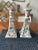 What a beautiful pair! These hand-painted, porcelain, candlestick holder set is adorned in a blooming butterfly garden...