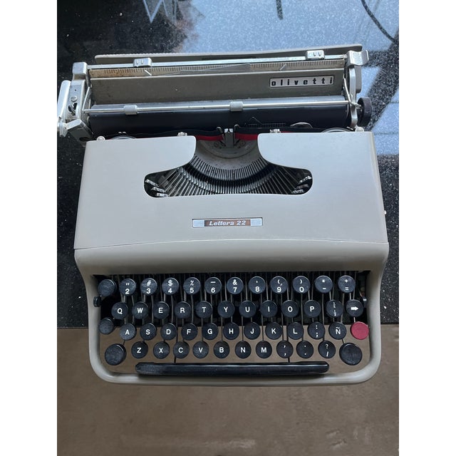 This Olivetti Manual Portable Typewriter Lettera 22 designed by Marcelo Nizzoli in Italy has a sleek modern body in near...