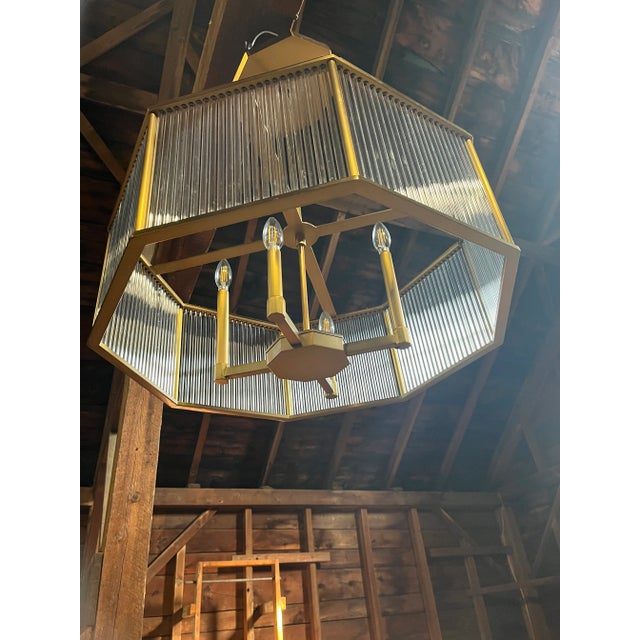 The Hera Chandelier by Arteriors Home is a modern representation of Greek and Roman columns. The 4-light chandelier uses...