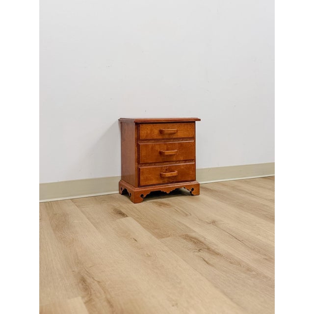 This charming vintage mini dresser with tiger engraved top is a beautifully crafted and characterful tabletop storage...